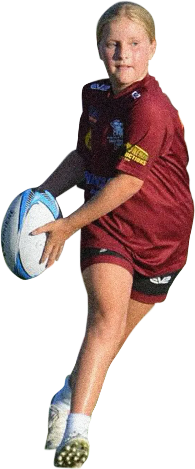 Young girl playing rugby league with a ball on the field.